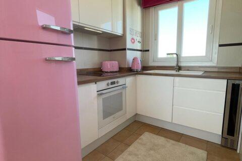 Pink and white kitchen