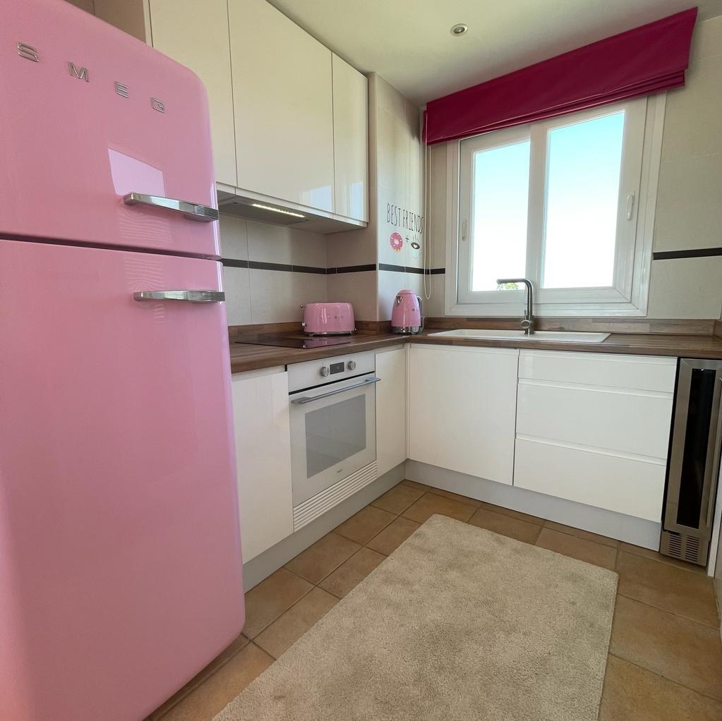 Pink and white kitchen